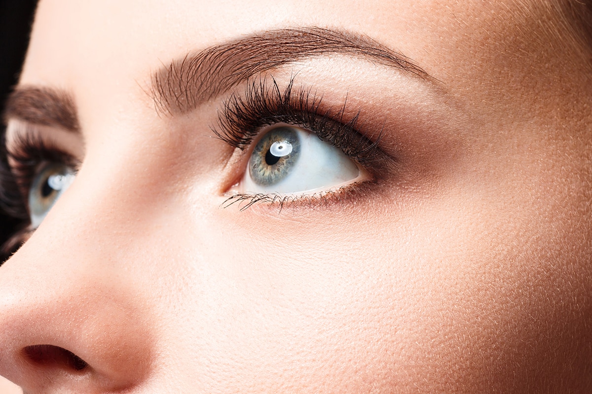 The beautiful face of young woman with cleanf fresh skin closeup picture of women's eyes